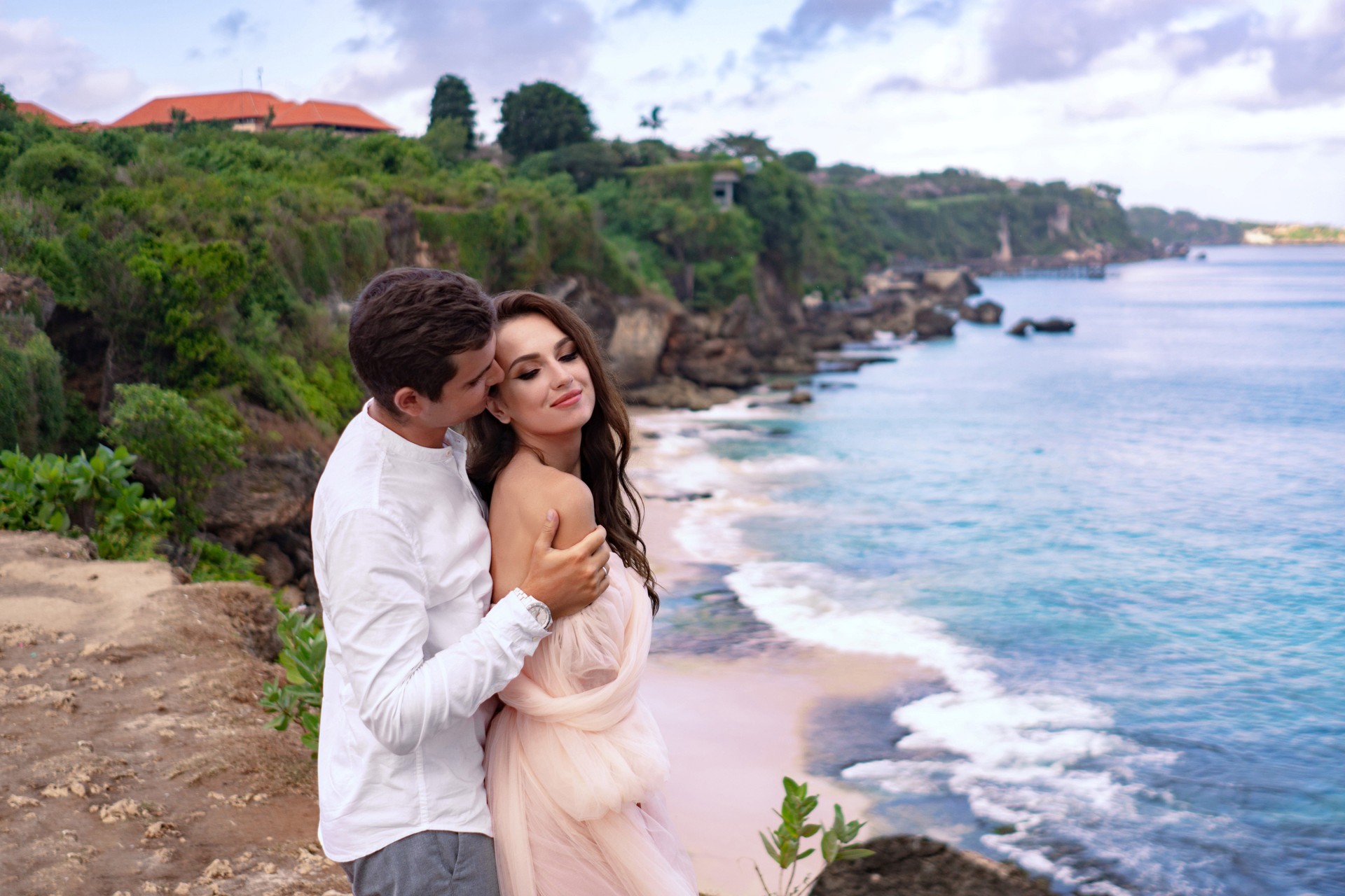 Caucasian newlyweds on nature tropical background